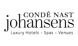 The image contains the logo for Condé Nast Johansens, with the text "Luxury Hotels • Spas • Venues" underneath.