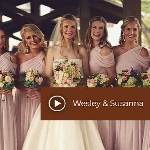 Six women in matching pale pink dresses, the center one in a wedding gown holding flowers. Text reads 